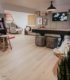 a living room filled with lots of furniture and decor