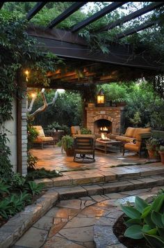 an outdoor fireplace and seating area in a backyard