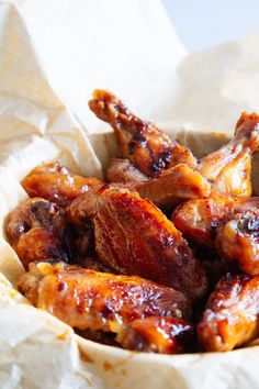 chicken wings with sauce in a paper bowl