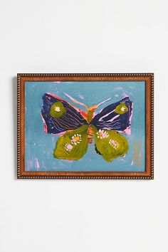 a painting on a wall with a butterfly painted on it's back and wings