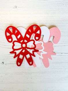 the paper cut outs have been placed on top of each other to make a butterfly decoration