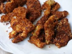 some fried food is on a white plate