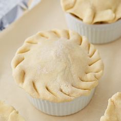 three small pies sitting on top of a table