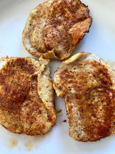 three pieces of fried meat on a white plate