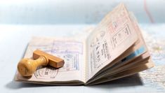 a wooden stamp sitting on top of an open book