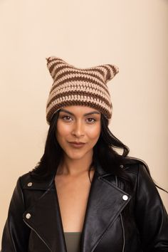 Stay warm and look cute in this purrfectly cozy cat ear crochet beanie! This comfy beanie features an adorable cat ear pattern, keeping you cozy and stylish all winter long. #completeyourlook #lovemyleto 100% Acrylic Imported Cat Ear Pattern, Cat Ear Crochet, Sorority Rush Dresses, Cozy Cat, Bachelorette Dress, Casual Bodysuit, Rush Dresses, Cat Ear, Jumpsuit Shorts Rompers