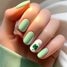 St. Patrick's Day Four Leaf Clover "Lucky Charms" Nails - St. Patrick's Day themed nail art, designed to be simple and cute. Each nail is painted with a soft pastel green, and the design is minimalistic, featuring just one small four-leaf clover on the ring finger for a subtle touch of luck and playfulness. Nail Art On One Finger, St Patricks Gel Nail Designs, Nail Ideas St Patricks Day, St Patricks Day Gel Nails Ideas, Nails For St Patricks Day Simple, St Patrick's Day Nail Art Designs, Aesthetic St Patricks Day Nails, Pastel St Patricks Day Nails