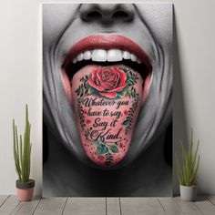 a woman's tongue with tattoos on it and the words whatever you have to say is