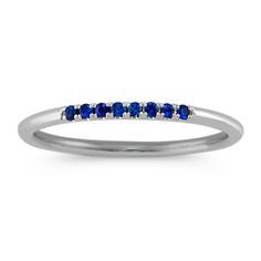 Wear this 2mm stackable ring alone or with multiple rings for an adorably chic style. Eight round pave-set traditional blue sapphires  at approximately .09 carat total weight  are set in quality 14 karat white gold. Stackable Sapphire Ring, Multiple Rings, Princess Cut Rings, Platinum Jewelry, Bridal Ring Set, Stackable Ring, Sapphire Jewelry, Favorite Rings, Stackable Rings