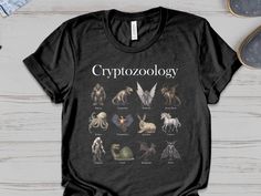 ⭐️ Handmade, Cotton, High Quality ⭐️ Perfect for cryptozoology enthusiasts and fans of mythical creatures. This design is a comprehensive encyclopedia of cryptids, featuring creatures like Bigfoot, the Loch Ness monster, and the chupacabra. This garment will make the perfect gift for your loved ones on any occasion - christmas, birthday, halloween or thanksgiving. 👕 T-SHIRT This T-Shirt fits like a well-loved favorite, featuring a crew neck, short sleeves and designed with superior combed and ring-spun cotton that makes it a true bestseller classic. * 100% Airlume combed and ring-spun cotton * Side-seamed * Retail Fit * Unisex Sizing 👉 SWEATSHIRT The classic crewneck sweatshirt in a cozy, super-soft 3-end fleece in an improved slimmer fit, with room to breathe. * 80% Ringspun cotton, 10% Cryptid Creatures, The Loch Ness Monster, Sublimation Ideas, Fashion Capsule Wardrobe, Loch Ness Monster, Loch Ness, Fashion Capsule, Shirt Fits, Casual Clothes