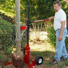 a man standing next to a red fire hydrant