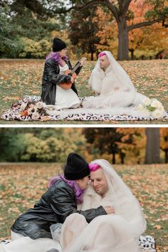 two people sitting on top of a blanket in the grass