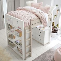 a bedroom with a bed, desk and drawers