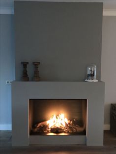 a fire place in the middle of a living room