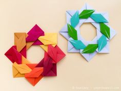 two origami pieces with leaves on them