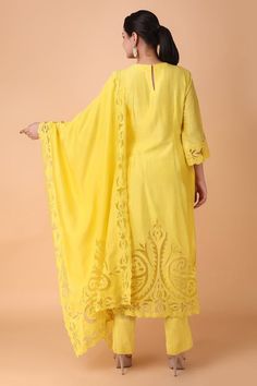 Yellow straight kurta with placement floral cutwork pattern. Paired with a pant and dupatta with floral cutwork pattern. - Aza Fashions Festive Semi-stitched Cutwork Kurta, Festive Straight Kurta With Cutwork, Festive Cutwork Kurta For Navratri, Festive Bollywood Anarkali Set With Cutwork, Chanderi Salwar Kameez With Cutwork Straight Kurta, Designer Cutwork Kurta For Eid, Unstitched Cutwork Salwar Kameez For Festive Occasions, Festive Chanderi Kurta With Cutwork, Unstitched Festive Kurta With Cutwork