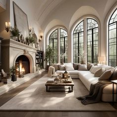 a living room filled with lots of furniture next to large windows and a fire place