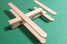 a wooden toy airplane with the words make - lollipop stick aeroplane