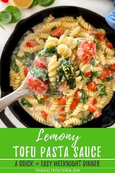 lemony tofu pasta sauce with spinach and tomatoes in a cast iron skillet