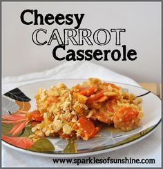 a close up of a plate of food with carrots and casserole on it