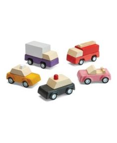 four wooden toy cars with different colors and shapes