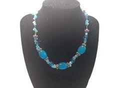 This necklace has medium blue beads and smaller light blue beads, It measures 16 inches long by .5 inches wide, The beads are glass. The blue will take your breath away! The beads are glass. Turquoise Glass Necklaces With Gemstone Beads, Blue Necklaces With Adjustable Oval Beads, Blue Beaded Necklaces With Oval Beads, Blue Oval Beaded Necklaces, Blue Beaded Oval Necklaces, Blue Czech Glass Necklace With Large Beads, Blue Oval Beads Necklaces For Jewelry Making, Adjustable Blue Beaded Turquoise Necklace, Blue Beaded Czech Glass Necklaces