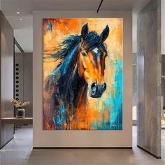 a painting of a horse is hanging on the wall