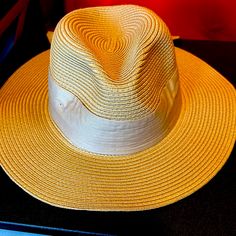 Approx. Dimensions: 22-1/2"L X 4"W; One Size Adjustable-Fit Band Packable Rolls Up With Snap Closure Fabric Tie Trim Polyester Spot Clean Adjustable Gold Panama Hat With Wide Brim, Adjustable Gold Fedora Panama Hat, Gold Adjustable Fedora Panama Hat, Gold Panama Fedora Hat With Adjustable Fit, Gold Panama Hat With Curved Brim For Beach, Gold Wide Brim Sun Hat For Summer, Gold Wide Brim Straw Hat For Summer, Gold Wide Brim Summer Straw Hat, Gold Brimmed Panama Hat For Beach