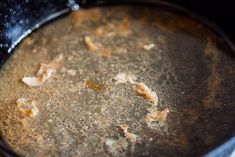 the food is being cooked in the pot on the stove top with water and oil