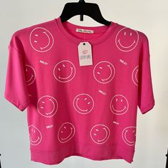 Smiley Faces Short Sleeve Tee Size M Color Pink And Also In White Color. Spread Joy With This Nwt Women Short Sleeve Tee Adorned With Smiley Faces. This Brand-New Tee Is A Delightful Addition To Your Wardrobe, Designed For Both Comfort And Style. The Happy Smiley Face Adds A Playful And Positive Touch, Making It A Perfect Choice For Casual Wear. Length 19.5 P To P 19 Smiley Face Shirt, Happy Smiley Face, Smiley Faces, Spread Love, Smiley Face, The Happy, Smiley, White Color, Pink Color