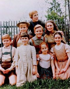 a group of children are posing for a photo