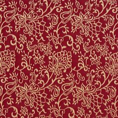 a red and gold fabric with white flowers on it