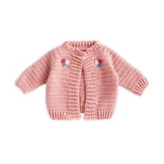 a pink knitted cardigan with flowers on the front and sleeves, sitting against a white background