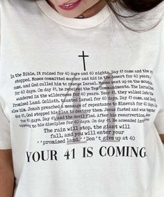 Introducing our "Your 41 Is Coming Graphic Shirt," a meaningful and inspirational addition to your faith-based wardrobe. Available in sizes YXS through 5XL, this natural-colored shirt features the encouraging phrase "Your 41 Is Coming," accompanied by stories from the Bible that highlight the significance of the number 41 and the good things that come with it. Crafted from high-quality, soft materials, this shirt ensures all-day comfort, making it perfect for church services, Bible study groups, spiritual gatherings, or casual wear. The "Your 41 Is Coming Graphic Shirt" serves as a reminder of faith, positivity, and perseverance, drawing inspiration from biblical events where the number 41 marked a time of breakthrough and blessings. Celebrate your faith and encourage others not to give up Encouraging Phrases, Bible Shirts, Faith Based Clothing, Bible Journal Notes, Spiritual Shirts, Bible Study Group, Scripture Art, Faith Based, Bible Inspiration