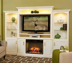 a living room with an entertainment center and deer on the television screen in front of it