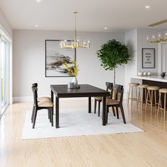 a dining room table with chairs and a potted plant in the middle of it