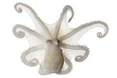 an octopus sculpture is shown against a white background