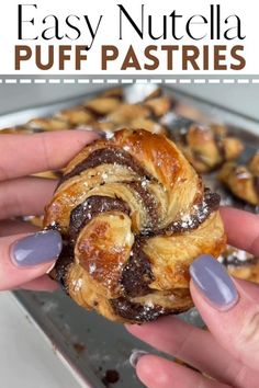 a person holding a pastry in their hand with the words easy nutella puff pastries