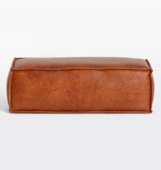 a brown leather storage bag on a white background