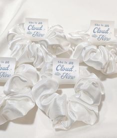 white satin scrunffles with small tags on them that say, cloud nine