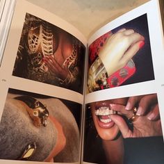 an open book with pictures of women's hands and rings on them, showing the inside pages