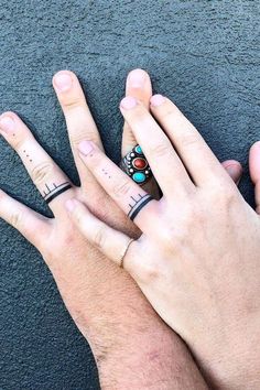 two people with matching rings on their fingers