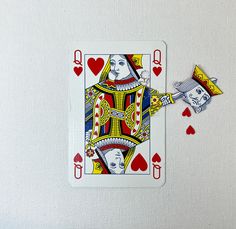 a playing card with two cards attached to it