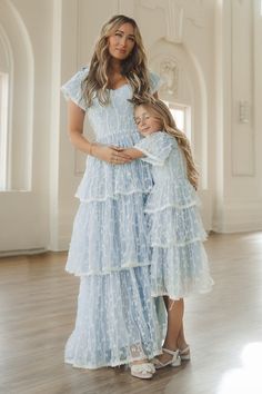 the mother and daughter are posing for a photo together