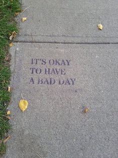 it's okay to have a bad day written on the sidewalk