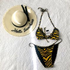 Kendall +Kyle Edgy, 2 Piece Swimsuit En Vogue Swim Look. Gets All The Attention. Very Sexycolor: Macro Tiger - Black & Bright Yellow. Bikini Top Back Tie Closure. Fully Lined - Imported - Hand Wash Fabric: Self: 80% Nylon, 20% Spandex Lining: 90% Polyester, 10% Spandex . Bottoms Mesh Trim Adds A Sporty Touch To These Cheeky Coverage Bikini Bottoms. Brings Instant Versatility To Your Beach Collection. Chic Yellow Stretch Swimwear, Chic Yellow Swimwear For Spring, Fitted Yellow Swimwear For The Beach, Fitted Yellow Swimwear For Beach Season, Mustard Swimwear For Summer Poolside, Chic Yellow Swimwear For Summer, Mustard Swimwear For Poolside In Summer, Yellow Fitted Triangle Top Swimwear, Fitted Yellow Triangle Top Swimwear