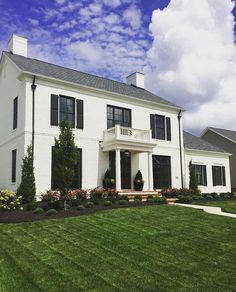 a large white house with lots of windows