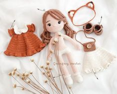 crocheted doll and accessories laid out on a white sheet with text that reads, free crochet pattern for dolls