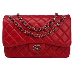 Chanel Classic Jumbo Double Flap Bag From 2014 with Gunmetal Hardware,Chain/Leather Straps,Interlocking CC Turn Lock Closure and Multiple Interior Compartments. Auth # 19986686 with Dustbag Designer = Chanel Color = Red Material = Lambskin Leather Condition = Very Good Height = 7.5 Width = 12 Depth = 3 1/2" Class = Premier Location: Chicago Item Number: 18321-1 Item ID: 255679 Category: Shoulder Bag Red Designer Bag With Double Flap, Red Designer Bags With Double Flap, Designer Red Double Flap Bag, Red Formal Bags With Double Flap, Classic Red Shoulder Bag With Chain Strap, Luxury Red Shoulder Bag With Palladium Hardware, Classic Red Bag With Chain Strap, Luxury Red Shoulder Bag, Chanel Classic Jumbo