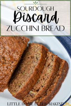 sliced zucchini bread on a white plate with the title text overlay reads sourdough biscard zucchini bread